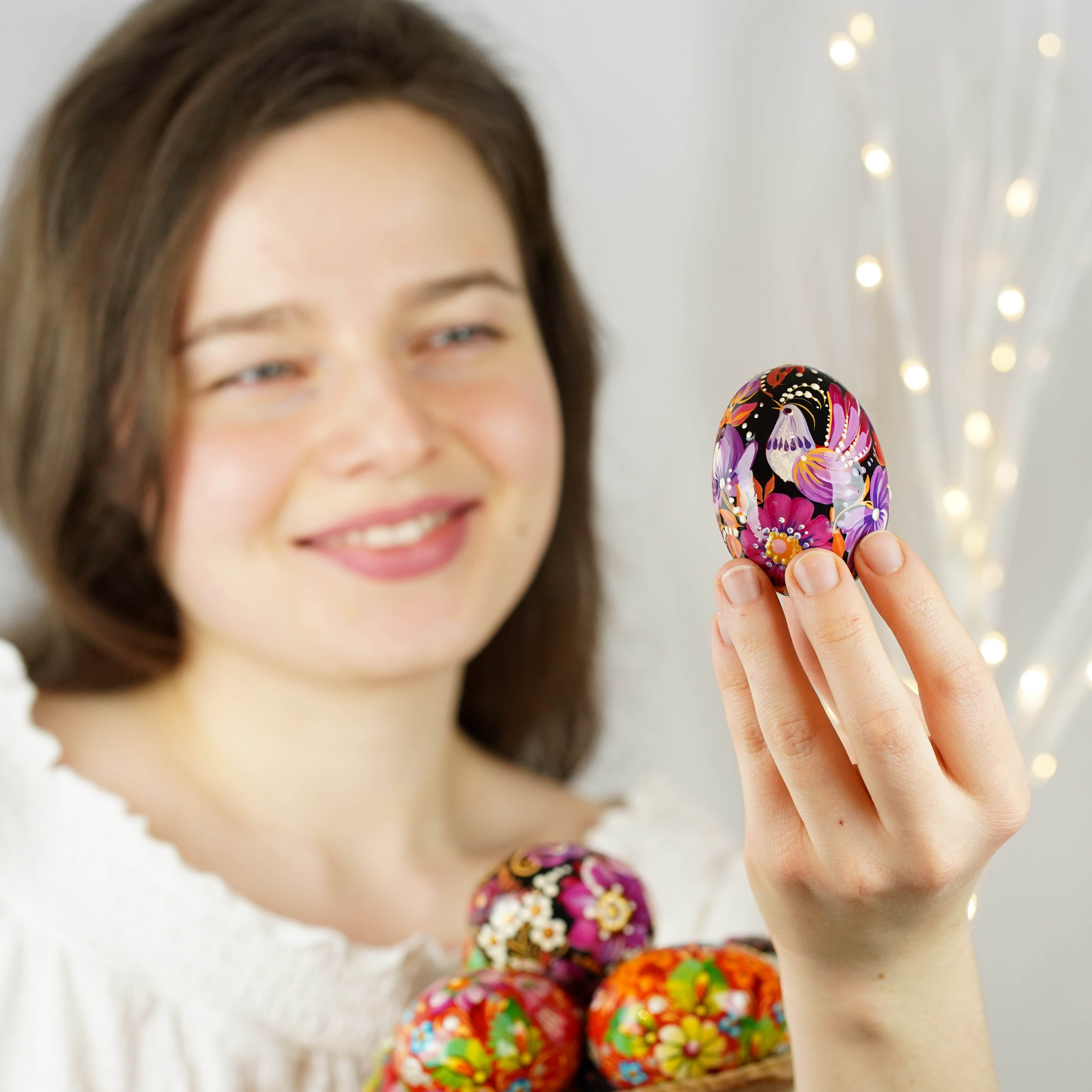 Hand-painted purple bird Easter egg carved from wood