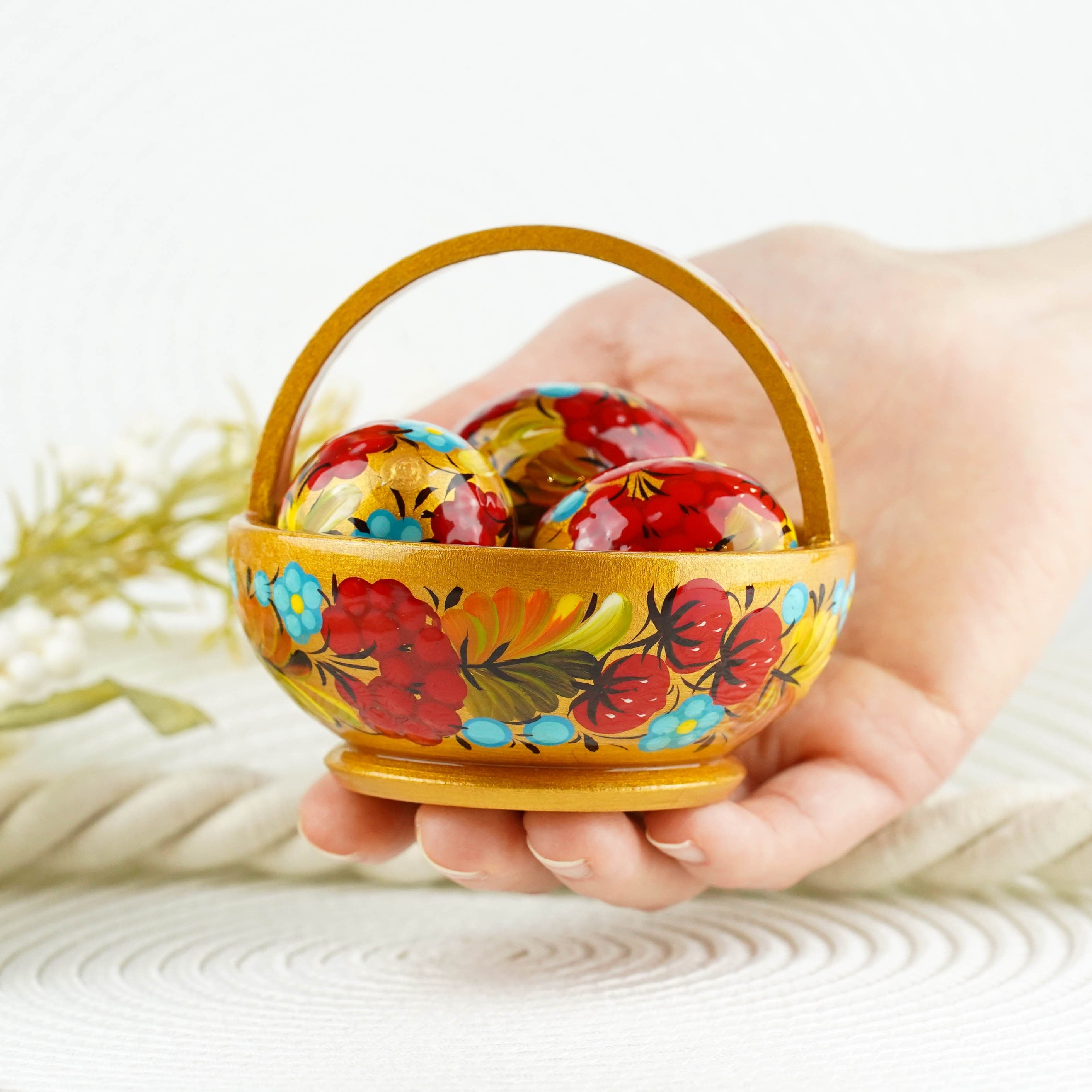 Wooden Easter basket with mini eggs, Painted small Petrykivka eggs, Red & gold flower Easter eggs in the basket, Cute Easter decor for home